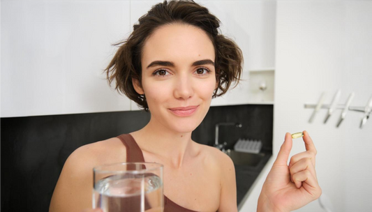 woman showing a glutathione tablet before consuming